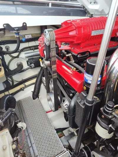  Yacht Photos Pics Engine compartment of a 2015 Formula 382 FASTech boat, featuring a red engine and components.