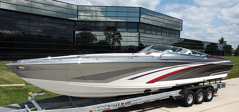  Yacht Photos Pics 2015 Formula 382 FASTech boat on trailer, sleek design, parked near modern glass building.