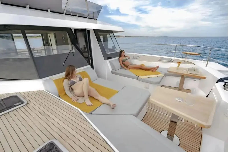  Yacht Photos Pics Luxury Aventura 56 MY 2026 yacht with sunbathing area and ocean view.