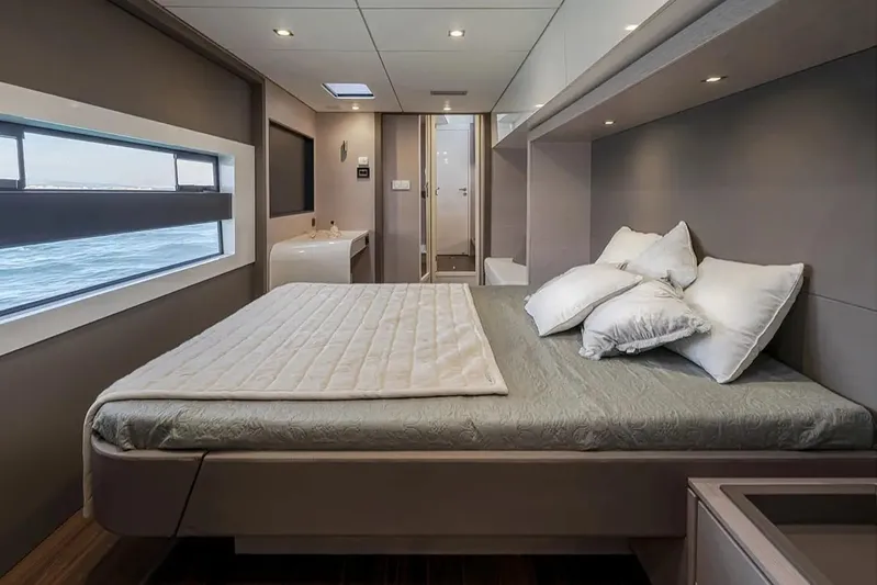  Yacht Photos Pics Luxurious bedroom interior of 2026 Aventura 56 MY yacht with ocean view.