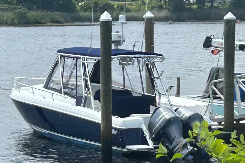  Yacht Photos Pics 2003 Intrepid 310 Walkaround boat docked with dual Yamaha outboard motors.