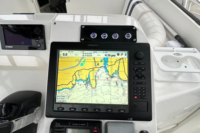  Yacht Photos Pics Navigation system on a 2003 Intrepid 310 Walkaround boat dashboard.