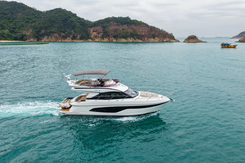  Yacht Photos Pics 2019 Princess F45 yacht cruising in scenic coastal waters.