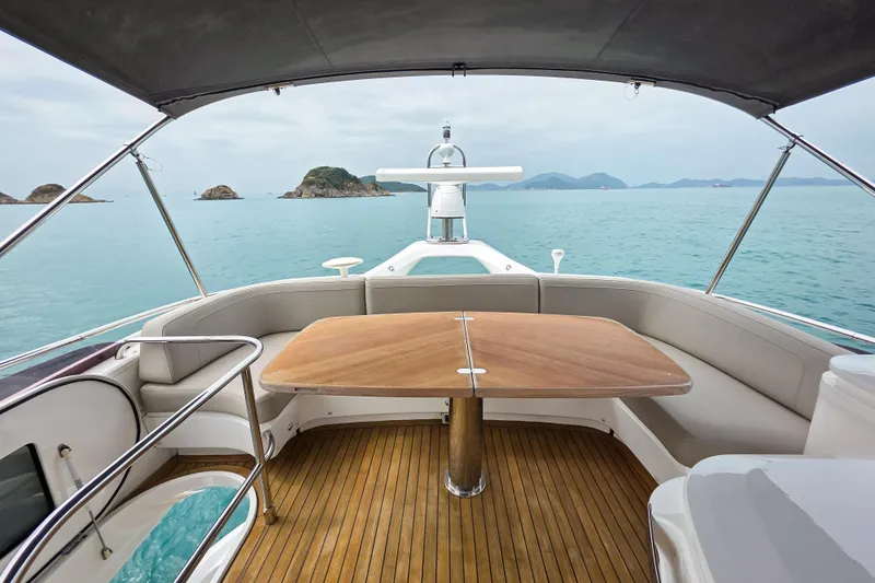  Yacht Photos Pics Luxurious 2019 Princess F45 yacht deck with seating, table, and ocean view.