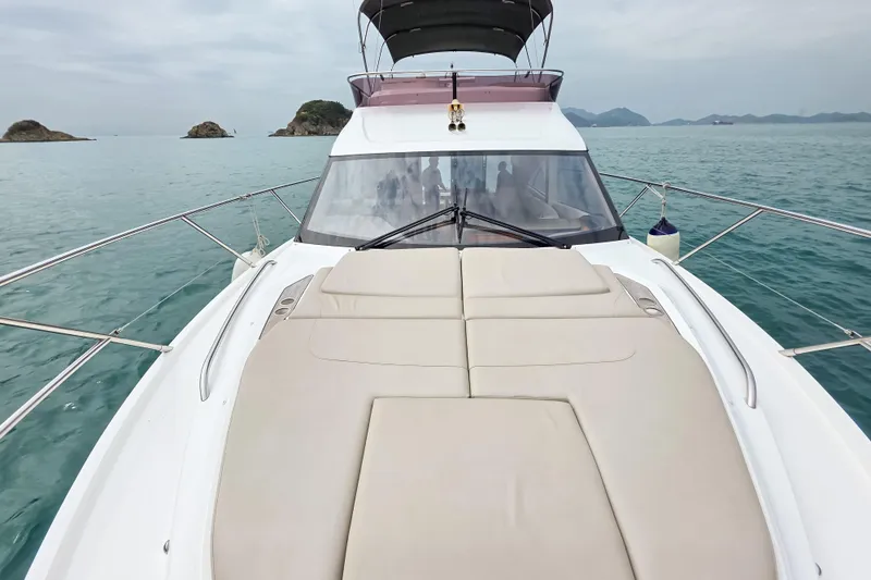  Yacht Photos Pics 2019 Princess F45 yacht on serene ocean, featuring spacious sunbathing deck.