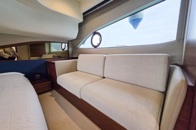  Yacht Photos Pics Luxurious interior of 2019 Princess F45 yacht with elegant sofa and large window view.