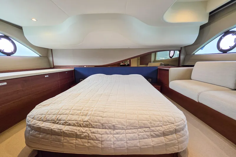  Yacht Photos Pics Luxurious 2019 Princess F45 yacht bedroom with elegant design and comfortable bedding.