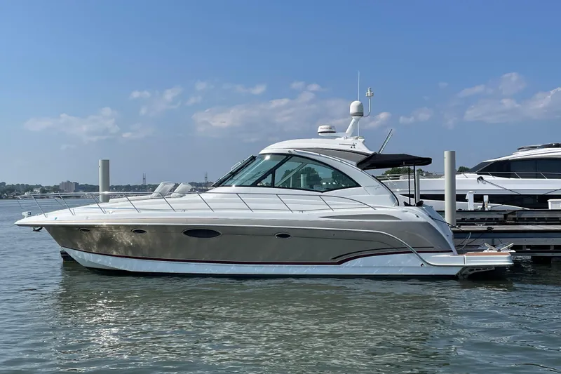  Yacht Photos Pics 2009 Formula 45 Yacht docked on calm water under a clear blue sky.
