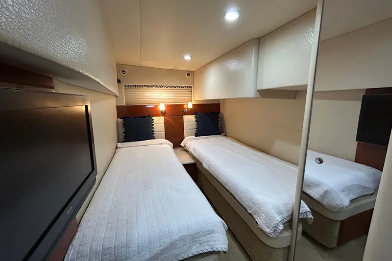  Yacht Photos Pics 2009 Formula 45 Yacht cabin with twin beds, modern lighting, and a wall-mounted TV.