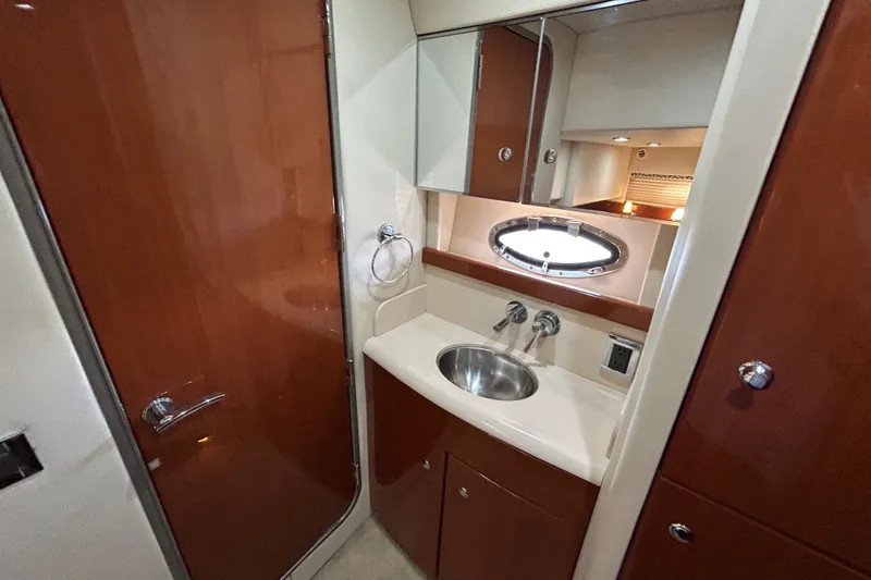  Yacht Photos Pics Luxurious bathroom interior of 2009 Formula 45 Yacht with wood accents and stainless steel sink.