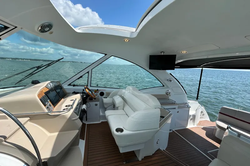  Yacht Photos Pics 2009 Formula 45 Yacht interior with modern helm, white seating, and ocean view.