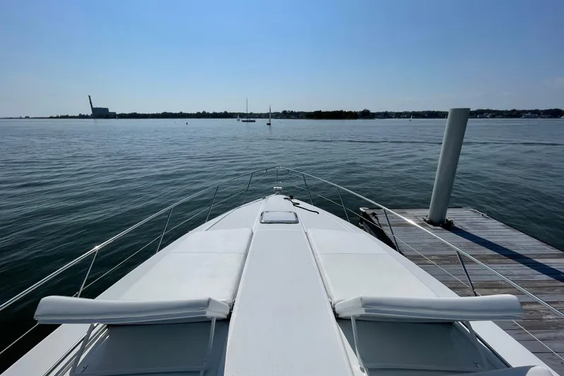  Yacht Photos Pics 2009 Formula 45 Yacht docked by calm waters under clear blue sky.