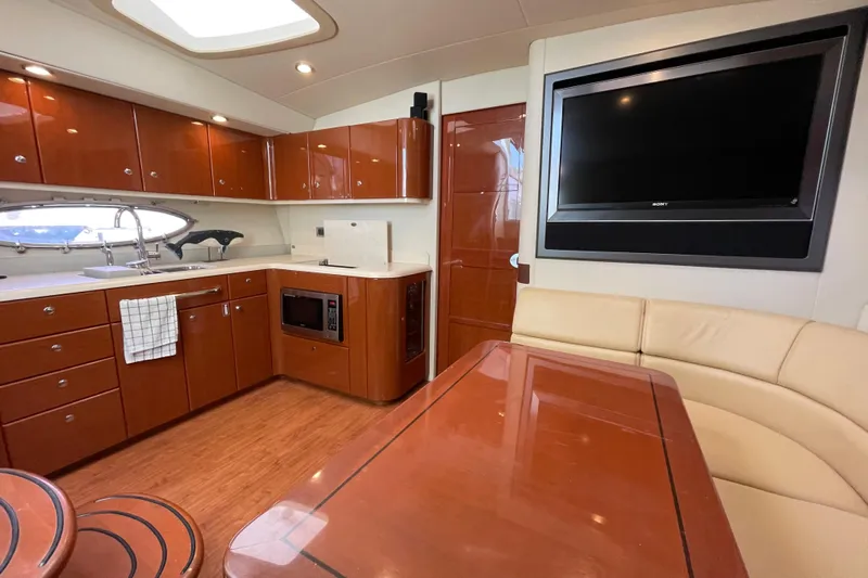  Yacht Photos Pics Luxurious interior of a 2009 Formula 45 Yacht with modern kitchen and seating area.