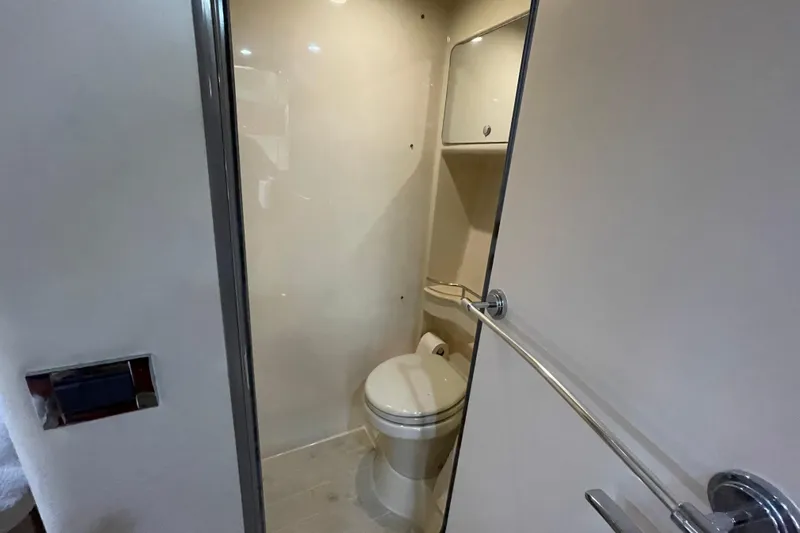  Yacht Photos Pics 2009 Formula 45 Yacht bathroom interior with toilet and storage cabinet.