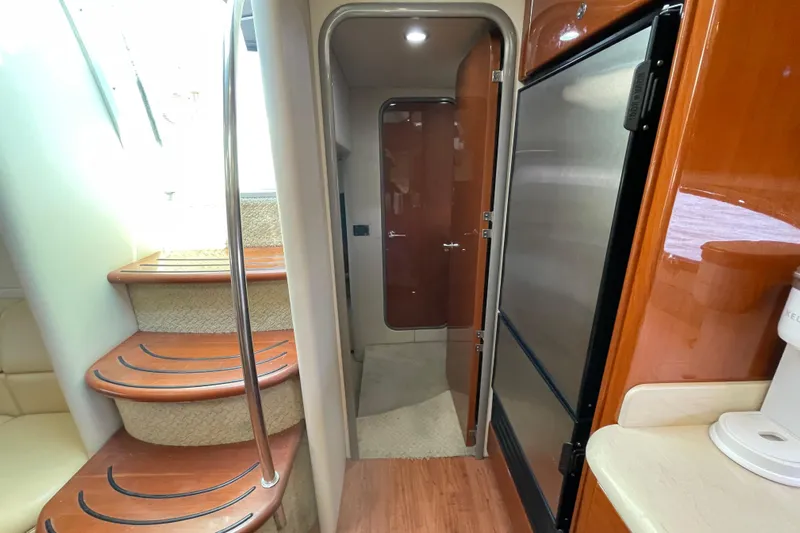  Yacht Photos Pics Interior of 2009 Formula 45 Yacht with wooden stairs and modern kitchen area.