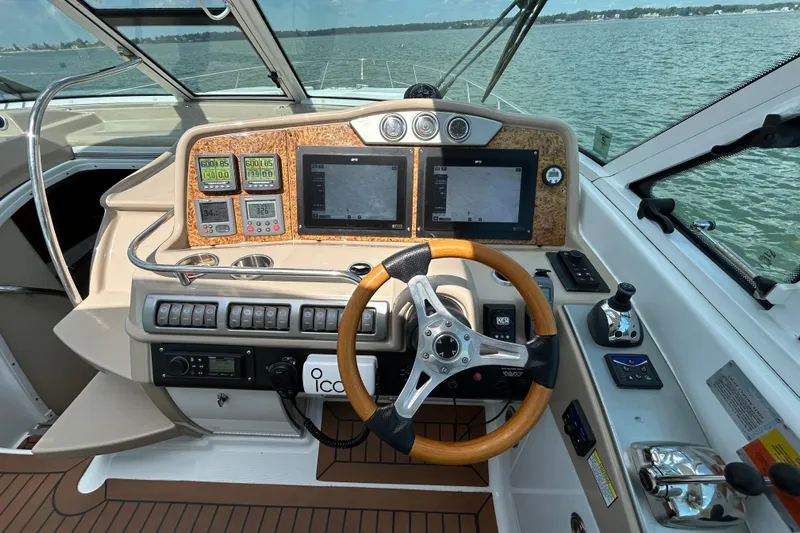  Yacht Photos Pics 2009 Formula 45 Yacht helm with navigation screens and controls on open water.