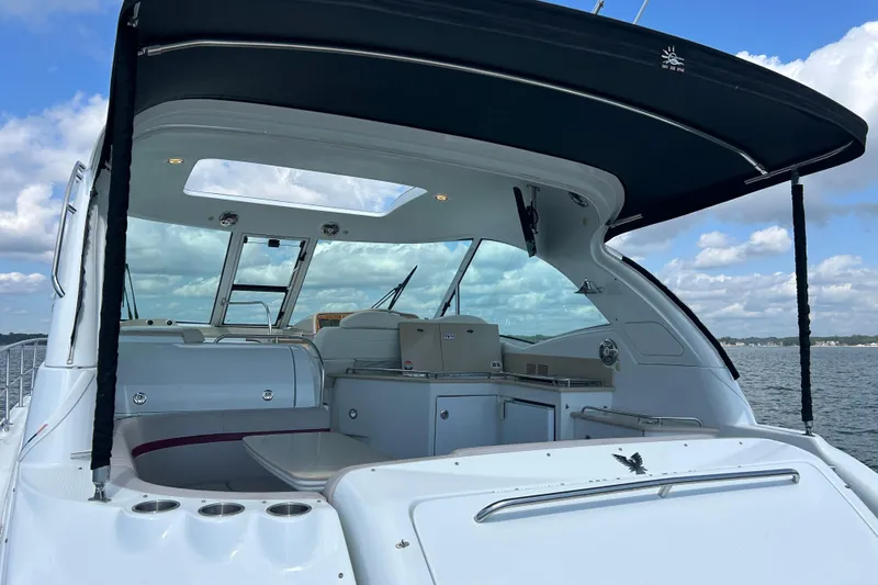  Yacht Photos Pics 2009 Formula 45 Yacht interior with seating and canopy on a sunny day.