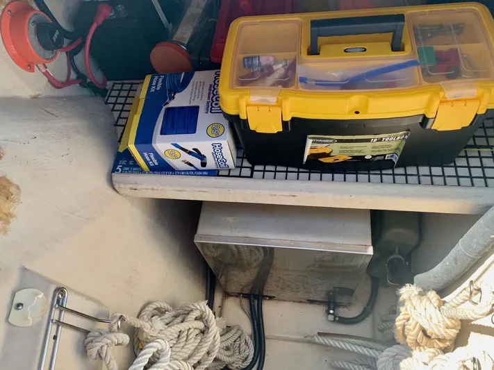 Tranquility Base Yacht Photos Pics Toolbox and hose kit in PDQ-34 boat storage, featuring ropes and electrical components.