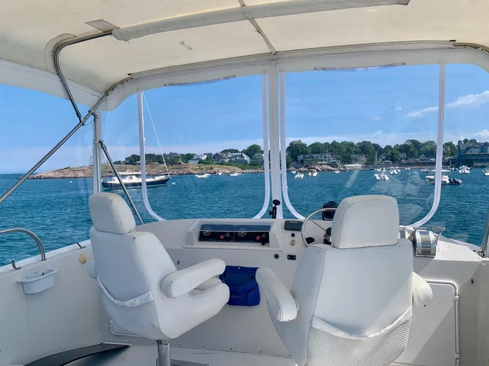 Tranquility Base Yacht Photos Pics Helm of 2003 PDQ-34 boat with ocean view and distant shoreline.