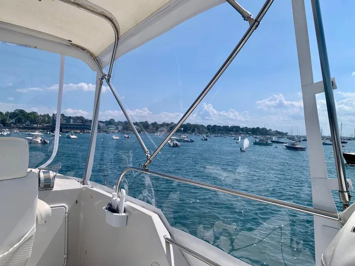Tranquility Base Yacht Photos Pics View from a 2003 PDQ-34 boat overlooking a scenic harbor with moored boats.