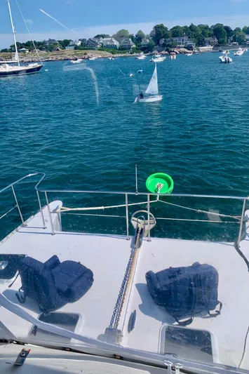 Tranquility Base Yacht Photos Pics View from PDQ-34 boat, 2003 model, overlooking a scenic harbor with sailboats.