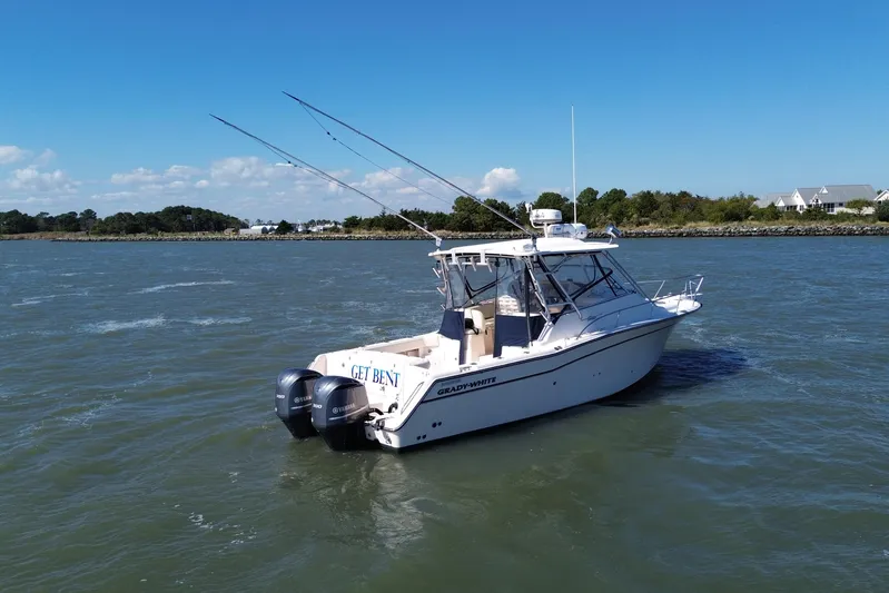 Get Bent Yacht Photos Pics 2005 Grady-White Express 330 boat on water, clear sky, coastal background.