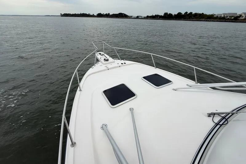 Get Bent Yacht Photos Pics 2005 Grady-White Express 330 boat on calm waters, view from the bow.