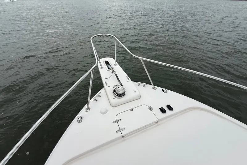 Get Bent Yacht Photos Pics Bow view of 2005 Grady-White Express 330 on calm water.