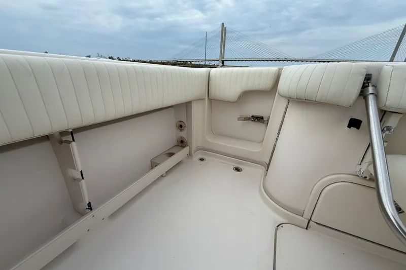 Get Bent Yacht Photos Pics 2005 Grady-White Express 330 boat interior with cushioned seating and railing.