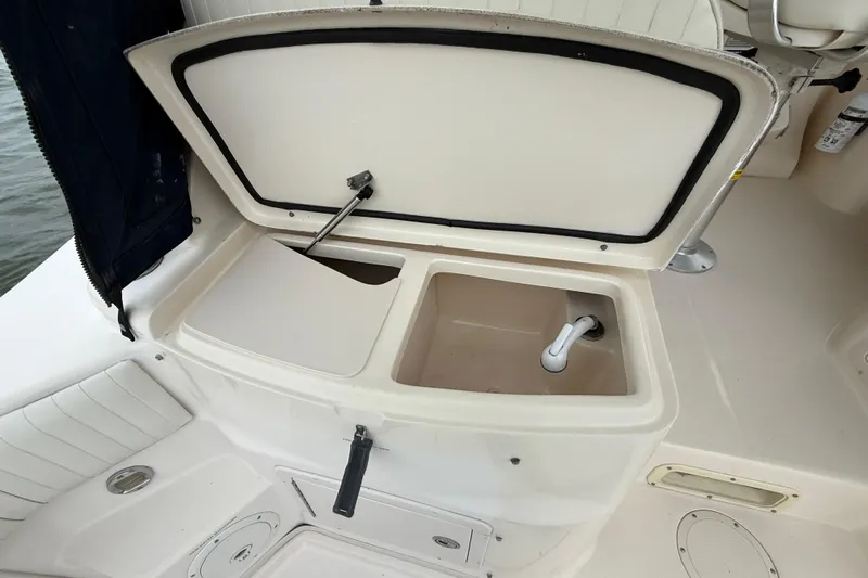 Get Bent Yacht Photos Pics 2005 Grady-White Express 330 boat sink and storage compartment open.