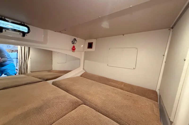 Get Bent Yacht Photos Pics 2005 Grady-White Express 330 cabin interior with beige cushions and compact design.