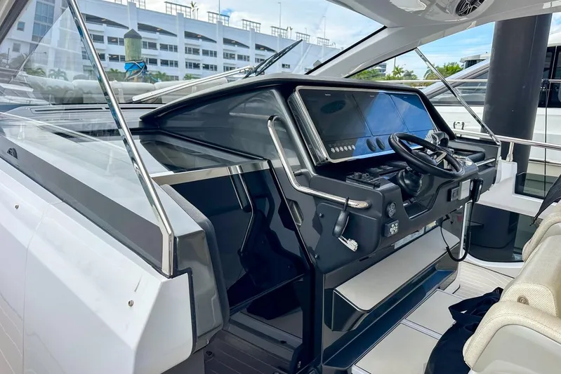  Yacht Photos Pics 2023 Azimut Verve 47 yacht cockpit with modern steering and navigation controls.