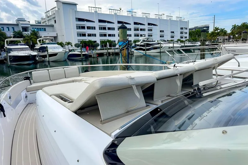  Yacht Photos Pics 2023 Azimut Verve 47 yacht with luxurious seating at a marina.