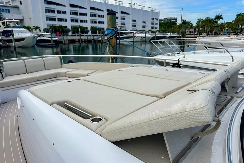  Yacht Photos Pics 2023 Azimut Verve 47 yacht with spacious sunbathing area and luxurious seating at marina.