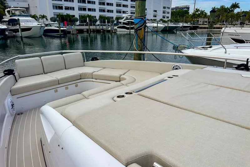  Yacht Photos Pics 2023 Azimut Verve 47 yacht with spacious seating at a marina.