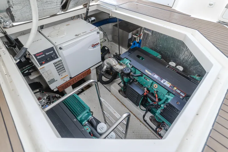 Eurybia Yacht Photos Pics Engine compartment of 2006 Cruisers Yachts 420 Express with visible generator and engines.