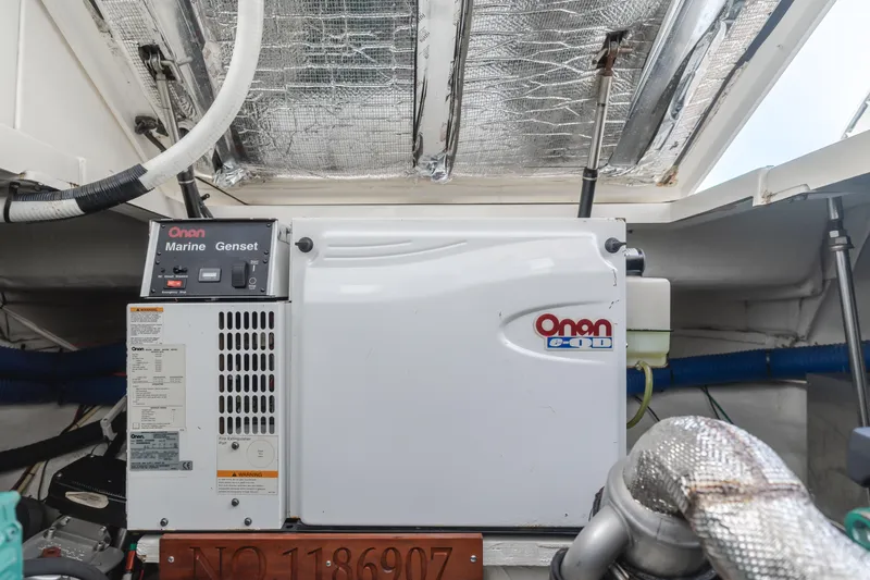 Eurybia Yacht Photos Pics Engine room of 2006 Cruisers Yachts 420 Express with Onan Marine Genset.