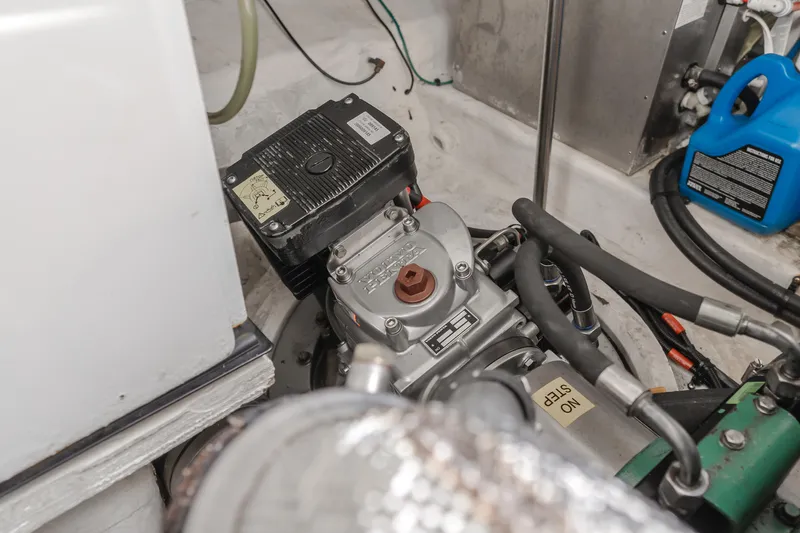 Eurybia Yacht Photos Pics Engine compartment of 2006 Cruisers Yachts 420 Express, showcasing mechanical components and hoses.