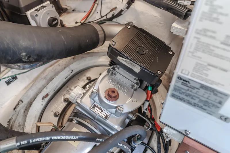 Eurybia Yacht Photos Pics Engine compartment of a 2006 Cruisers Yachts 420 Express, showcasing mechanical components and wiring.