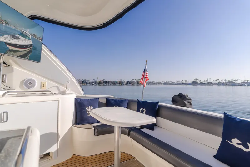 Eurybia Yacht Photos Pics 2006 Cruisers Yachts 420 Express interior with seating, table, and scenic water view.