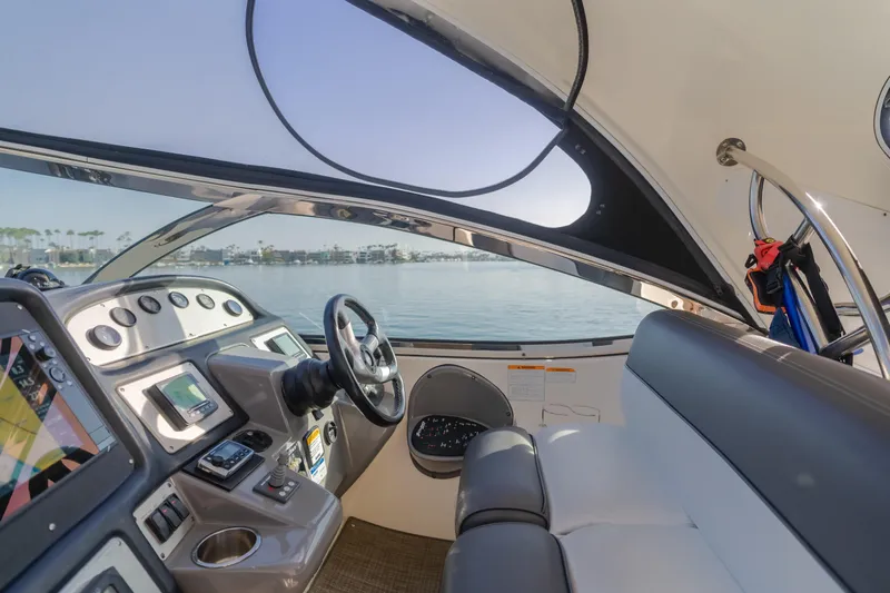 Eurybia Yacht Photos Pics Interior view of 2006 Cruisers Yachts 420 Express helm with modern controls and seating.