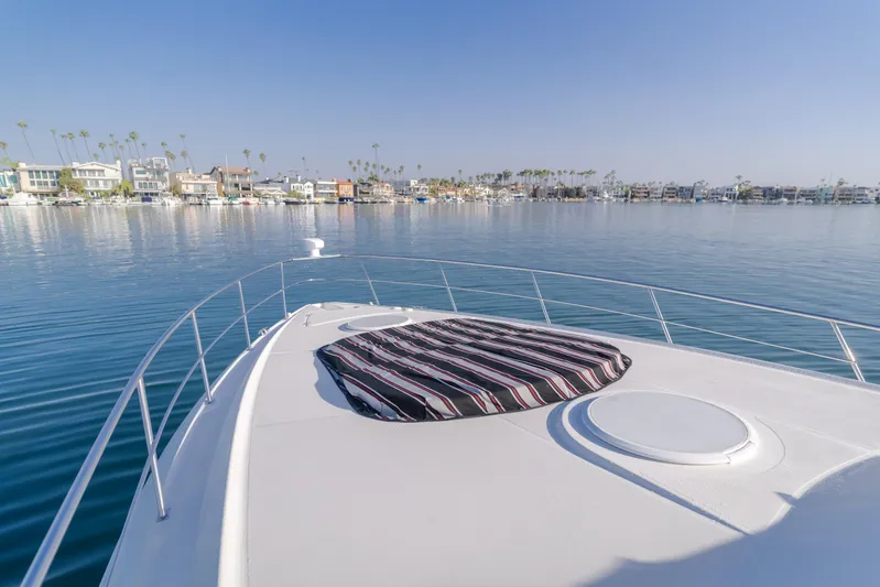 Eurybia Yacht Photos Pics 2006 Cruisers Yachts 420 Express on calm water with scenic coastal view.