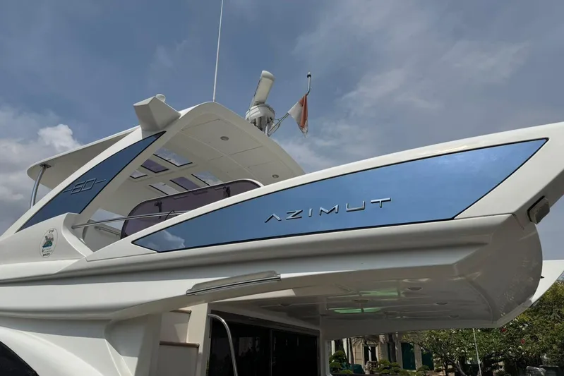  Yacht Photos Pics 2012 Azimut 60 yacht, sleek design, blue accents, clear sky background.