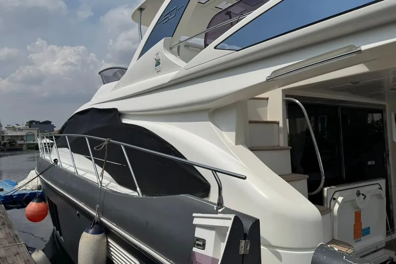  Yacht Photos Pics 2012 Azimut 60 yacht docked, showcasing sleek design and modern features.