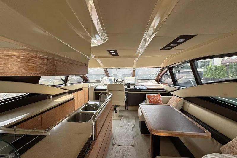  Yacht Photos Pics Luxurious interior of a 2012 Azimut 60 yacht with modern kitchen and seating area.