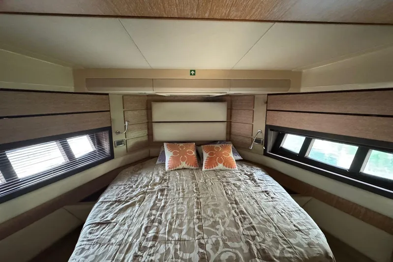 Yacht Photos Pics Luxurious bedroom interior of 2012 Azimut 60 yacht with elegant bedding and windows.