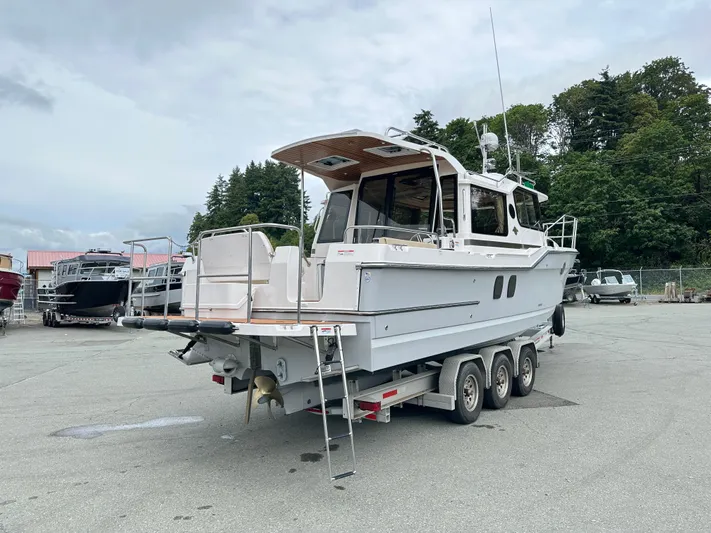  Yacht Photos Pics 2025 Ranger Tugs R29 S boat on trailer in outdoor setting.