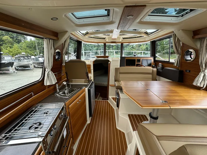  Yacht Photos Pics Interior of 2025 Ranger Tugs R29 S, featuring wood finishes and modern amenities.