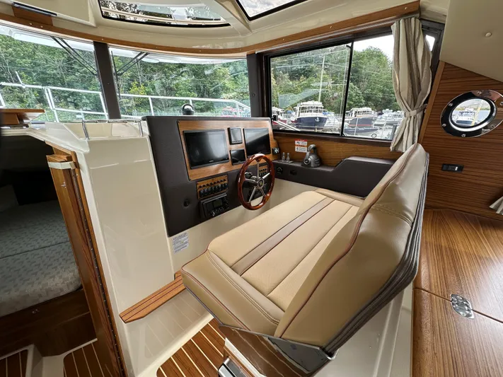  Yacht Photos Pics Interior of 2025 Ranger Tugs R29 S boat with modern helm and seating.