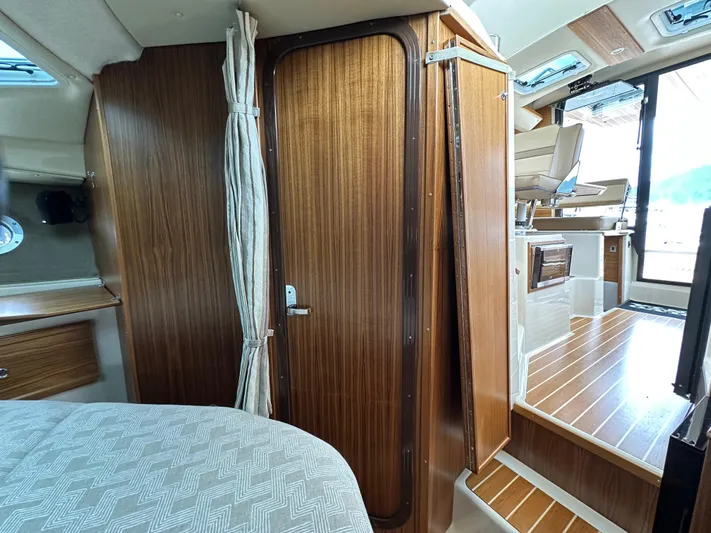  Yacht Photos Pics Interior of 2025 Ranger Tugs R29 S, featuring wood paneling and modern design elements.